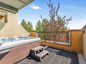 Patio / terrace featuring a hot tub