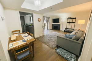 Living area with wood finished floors and a fireplace