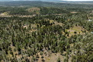 Aerial overview of property's location featuring a mountainous background