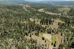 Aerial view of property's location with a mountainous background