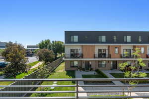 View of front of house with a balcony