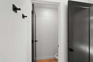 Bathroom with light wood finished floors and baseboards