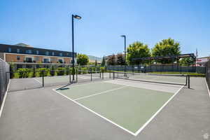 View of tennis court featuring community basketball court