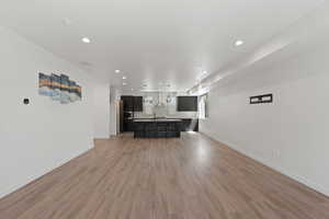Unfurnished living room featuring recessed lighting and light wood finished floors