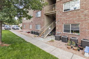 View of property with stairs