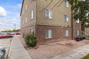 View of side of property with brick siding and stucco siding