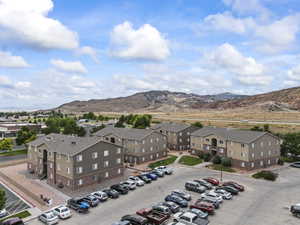 Aerial perspective of suburban area featuring a mountainous background
