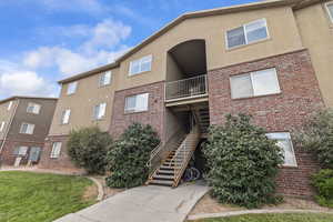 View of property with stairs
