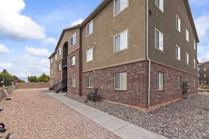 View of home's exterior featuring brick siding