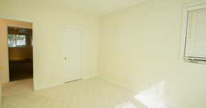 Unfurnished bedroom with baseboards and carpet