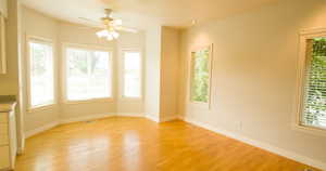 Spare room featuring light wood finished floors and a ceiling fan