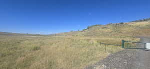 View of lot 53 from gate with mountain background with rural landscape