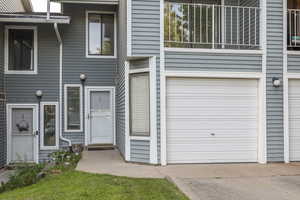 View of front facade featuring a garage