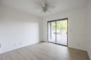 Unfurnished room with light wood finished floors and ceiling fan
