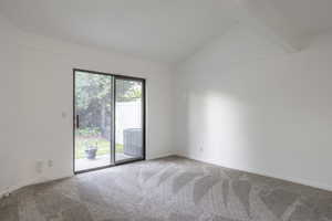 Spare room featuring carpet flooring