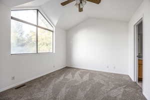 Unfurnished bedroom with vaulted ceiling, carpet flooring, and ceiling fan