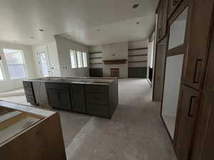 Kitchen with plenty of natural light and a kitchen island