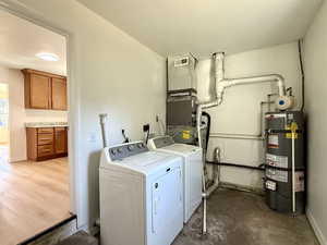 Washroom with water heater and separate washer and dryer