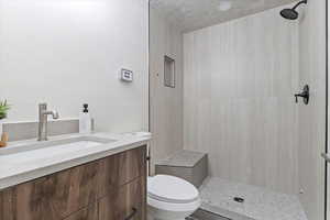 Bathroom with vanity and a shower stall
