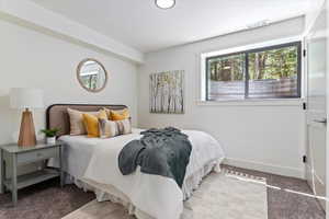 Bedroom featuring baseboards and carpet flooring