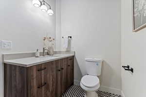 Bathroom featuring vanity and toilet