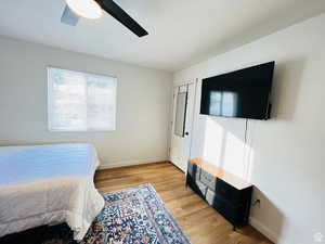 Bedroom with light wood-style flooring and ceiling fan