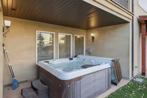 View of patio featuring a hot tub