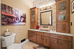 Bathroom featuring vanity and tile patterned flooring