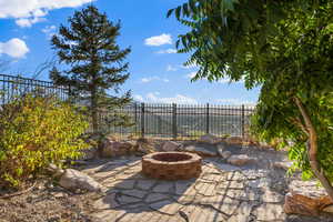 View of patio / terrace with a fire pit