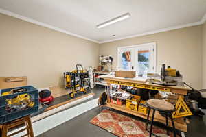 Miscellaneous room featuring crown molding, french doors, and concrete flooring