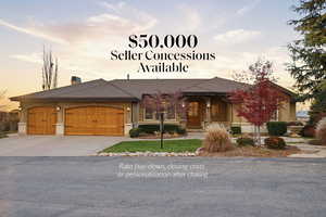 View of front of property featuring an attached garage, concrete driveway, a chimney, and stucco siding
