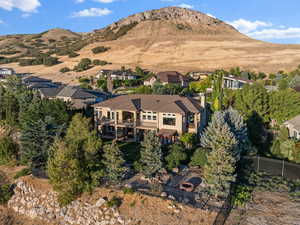 Aerial overview of property's location featuring a mountainous background