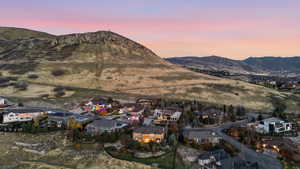 View of mountain backdrop with nearby suburban area