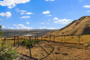 View of yard featuring a mountain view and a view of countryside