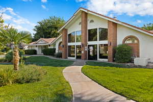 Clubhouse Surrounded by Mature Trees and Grass