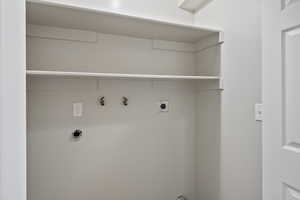 Laundry room with hookup for a washing machine and hookup for an electric dryer