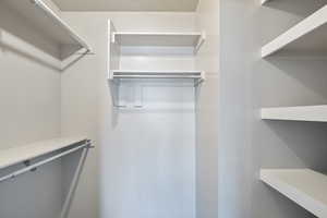 View of spacious closet for primary bedroom