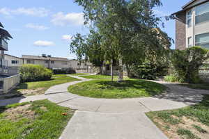 Kentwood common ground area/courtyard with grass and sidewalk