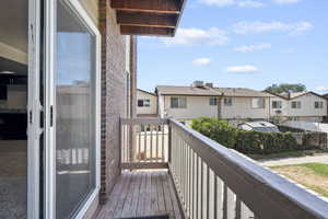 Wooden terrace featuring a residential view