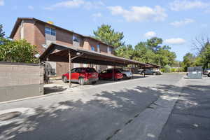Alternative view of covered parking lot and front of home