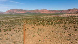 View of mountain backdrop with a desert landscape and rural landscape