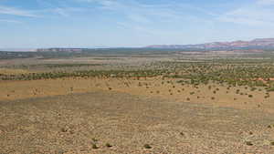 View of mountain backdrop with rural landscape