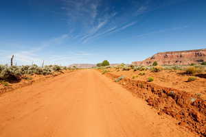 View of dirt / gravel road featuring a view of countryside