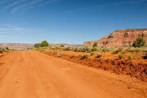 View of dirt / gravel road with a view of countryside
