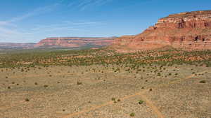 View of mountain backdrop with a desert landscape and rural landscape