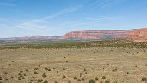 View of mountain backdrop featuring a desert landscape and rural landscape