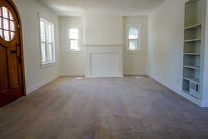 Entryway featuring hardwood / wood-style floors and a textured ceiling