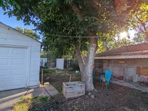 View of yard with a garage