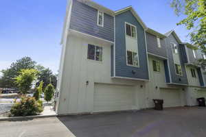 Back of house featuring board and batten siding and an attached garage