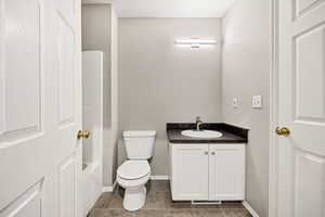 Full bathroom featuring vanity and light tile patterned flooring